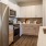 a kitchen with white cabinets