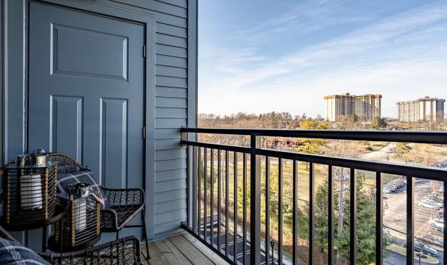 Spacious balconies a balcony with a view of some tall buildings