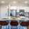 a kitchen with an island and chairs
