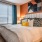 a bedroom with a bed and lamps