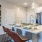 a kitchen with an island and chairs